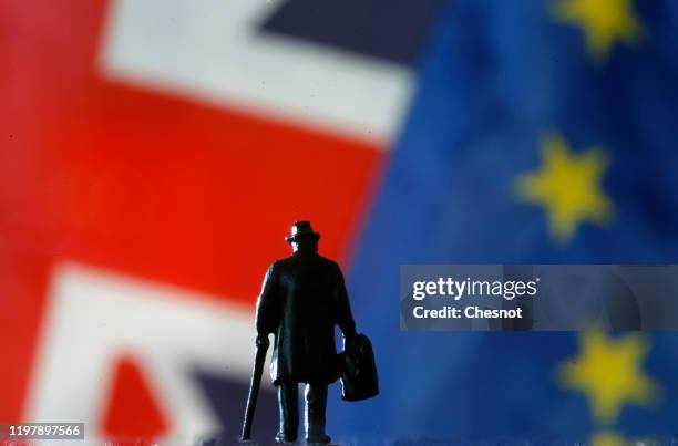 In this photo illustration, a small toy figure is seen in front of British and European flags on January 06, 2020 in Paris, France. The procedure for...