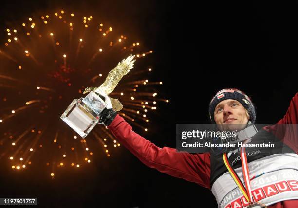 Dawid Kubacki of Poland celebrates winning with the golden eagle trophy after the 68th FIS Nordic World Cup Four Hills Tournament at...