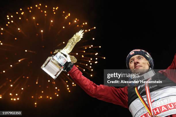 Dawid Kubacki of Poland celebrates winning with the golden eagle trophy after the 68th FIS Nordic World Cup Four Hills Tournament at...