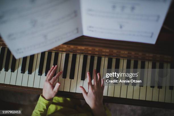 hands playing piano - keyboard musical instrument child stock pictures, royalty-free photos & images