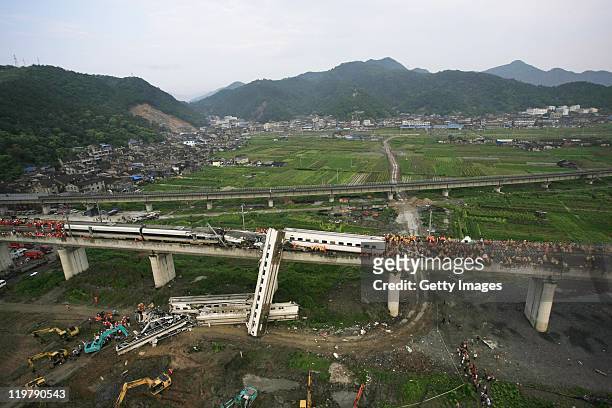 An aerial view of rescuers working around the accident site where two trains had collided on a bridge on July 24, 2011 in Wenzhou, Zhejiang Province...
