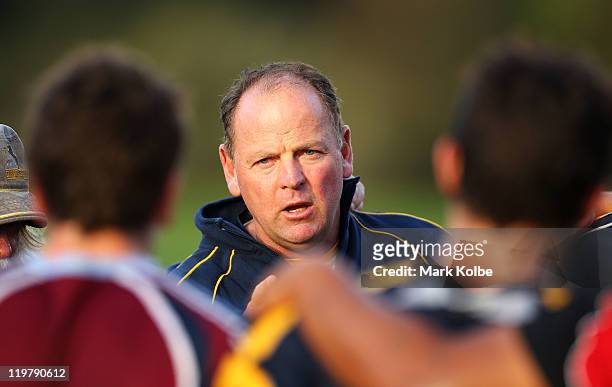 Head Coach Jake White speaks to the players during an ACT Brumbies training camp at Narrabeen Sport and Recreation Ground on July 25, 2011 in Manly,...
