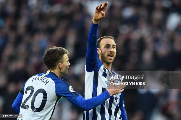 Brighton's English striker Glenn Murray celebrates scoring his team's third goal with Brighton's English midfielder Solly March during the English...