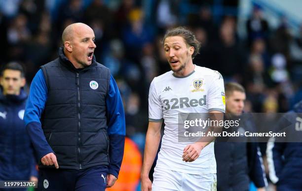 Wigan Athletic manager Paul Cook has words with Leeds United's Luke Ayling during the Sky Bet Championship match between Leeds United and Wigan...