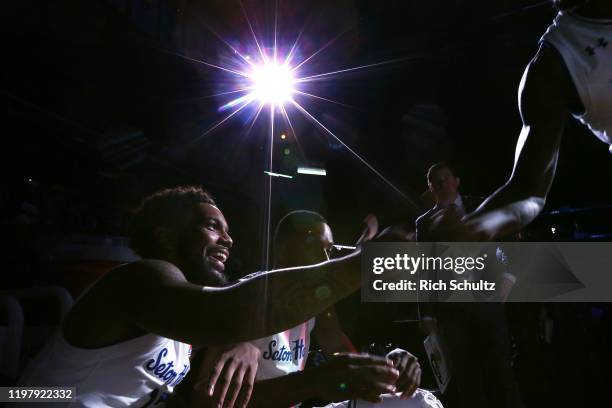 Myles Powell of the Seton Hall Pirates fist bumps a teammate before being introduced before a college basketball game against the Xavier Musketeers...