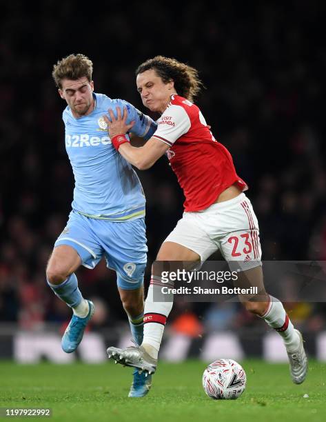 David Luiz of Arsenal holds off Patrick Bamford of Leeds United during the FA Cup Third Round match between Arsenal FC and Leeds United at the...