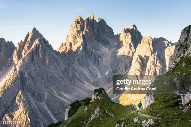 one man hiking at the cadini di misurina, dolomites, italy - dolomites stock pictures, royalty-free photos & images