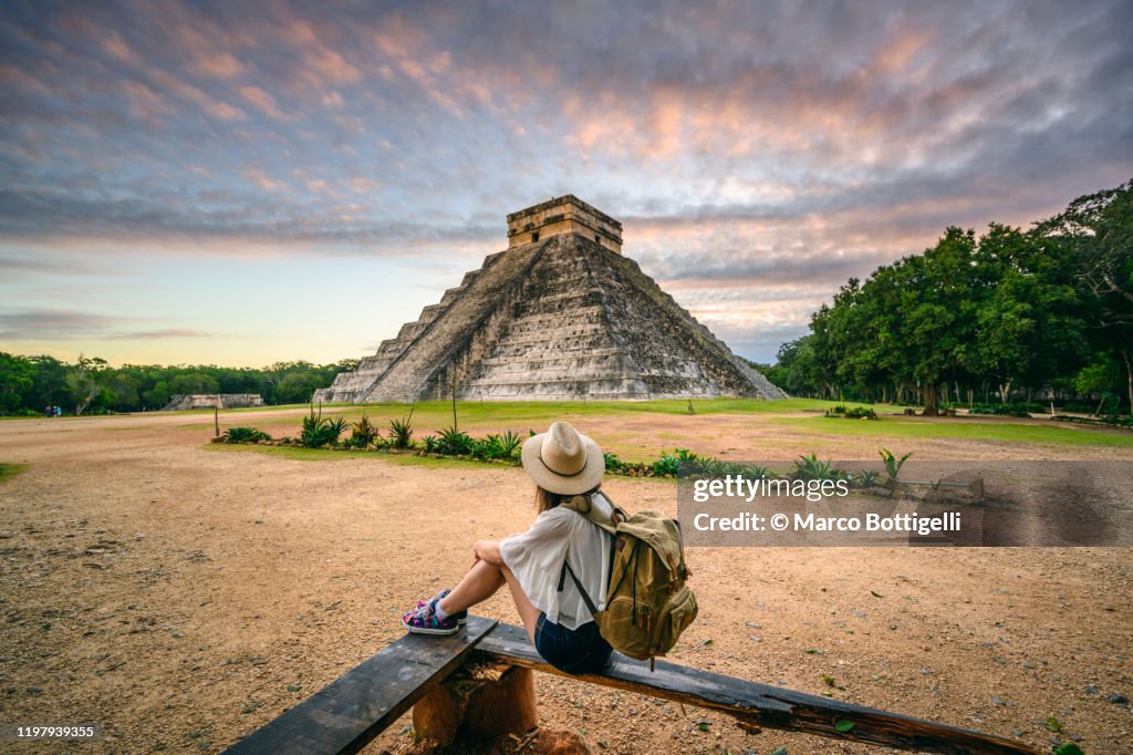 Tourist exploring Chichen-Itza archaeological site, Yucatan, Mexico