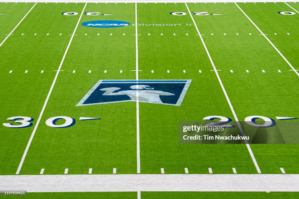 The NCAA Division II and football championship logos are seen during