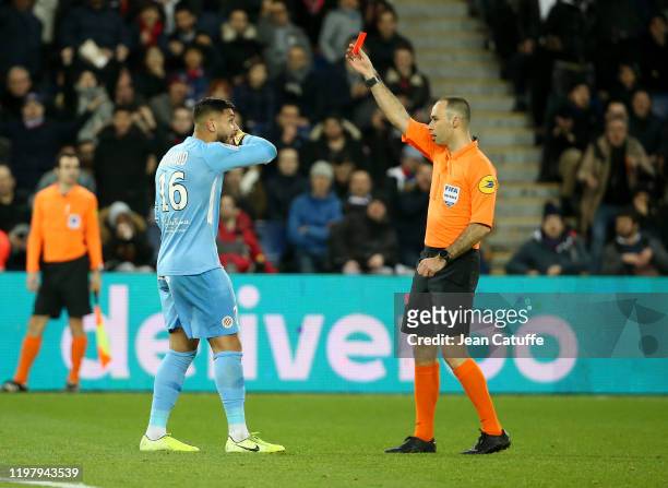 Goalkeeper of Montpellier Matis Carvalho receives a red card from referee Jerome Brisard during the Ligue 1 match between Paris Saint-Germain and...