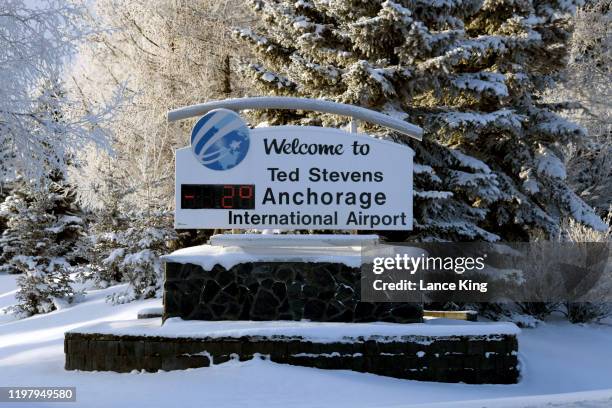 Welcome sign at Ted Stevens Anchorage International Airport indicates the temperature is negative two degrees Fahrenheit at 12:09 pm on January 6,...