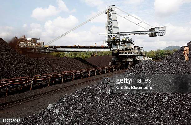 Bucket wheel excavator moves coal onto a conveyor belt at the PT Bukit Asam open pit coal mine in Tanjung Enim, South Sumatera province, Indonesia,...