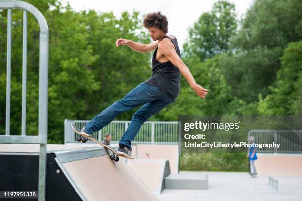 skateboard trick - man skating stock pictures, royalty-free photos & images