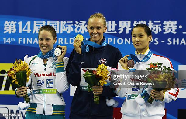 Silver medalist Alicia Coutts of Australia, gold medalist Dana Vollmer of the United States and Ying Lu of China pose for a photo on the podium...