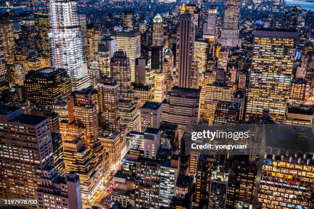 crowded skyscrapers in midtown manhattan - yongyuan usa stock pictures, royalty-free photos & images