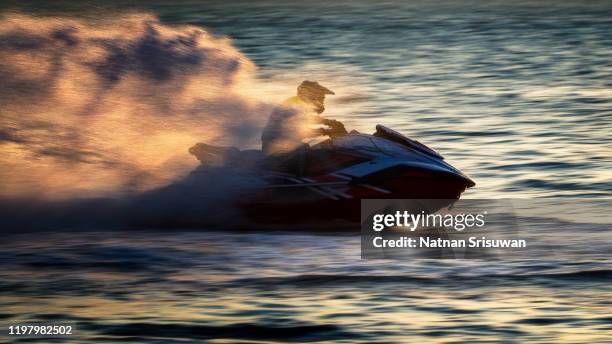 man drive on the jet ski. - jet boat fotografías e imágenes de stock