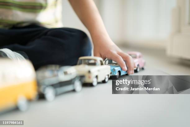 kid playing with vintage cars toys - boy kid playing cars stock pictures, royalty-free photos & images