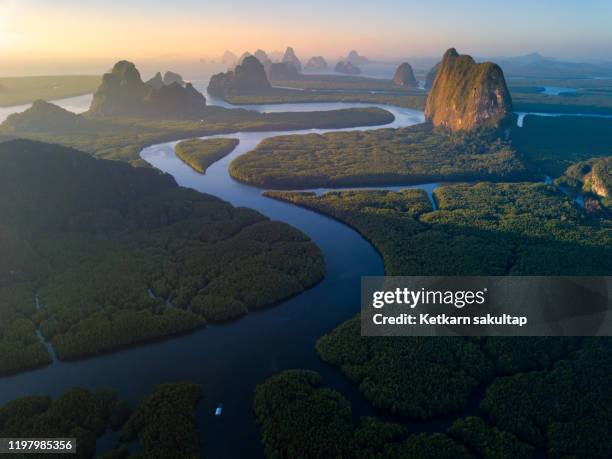 beautiful landscape phangnga bay leading by curve of canals and mangrove forest, thailand. - james bond island stock pictures, royalty-free photos & images