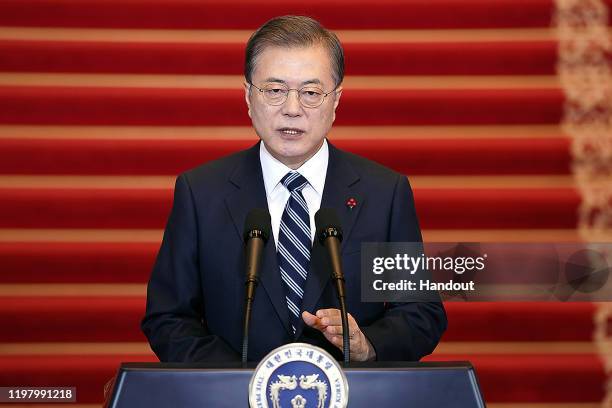 In this handout image provided by South Korean Presidential Blue House, South Korean President Moon Jae-in speaks during his New Year's speech at the...