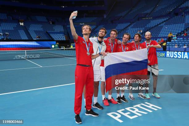 Daniil Medvedev, Karen Khachanov, Marat Safin, Teymuraz Gabashvili, Ivan Nedelko and Konstantin Kravchuk of Team Russia take a selfie after winning...