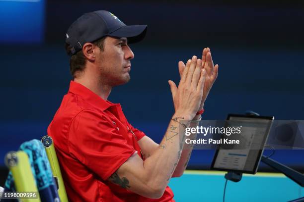 Marat Safin, captain of Team Russia acknowledges Teymuraz Gabashvili and Konstantin Kravchuk from the team zone during the Team Russia and Team...