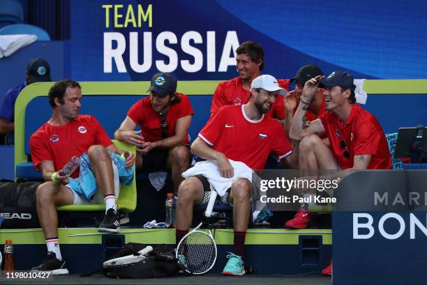 Marat Safin, captain of Team Russia talks with Konstantin Kravchuk during the doubles match between Team Russia and Team Norway on day five of the...