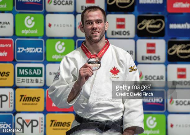 Under 81kg London Olympic bronze medallist and 2014 World silver medallist, Antoine Valois-Fortier of Canada proudly shows his bronze medal during...