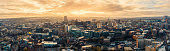 Aerial Panoramic view above Sheffield City during frosty winter morning with golden sunrise