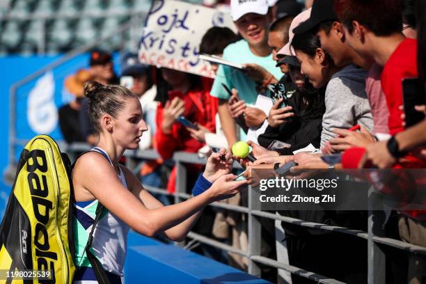 Kristyna Pliskova of the Czech Republic signs autograph for fans after the match against Aryna Sabalenka of Belarus on Day 3 of 2020 WTA Shenzhen...