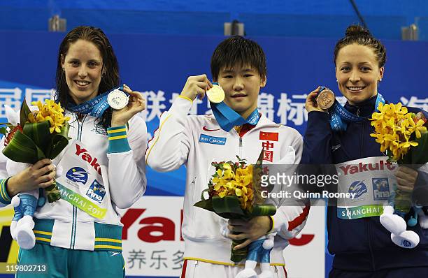 Silver medalist Alicia Coutts of Australia, gold medalist Shiwen Ye of China and bronze medalist Ariana Kukors of the United States pose for a photo...