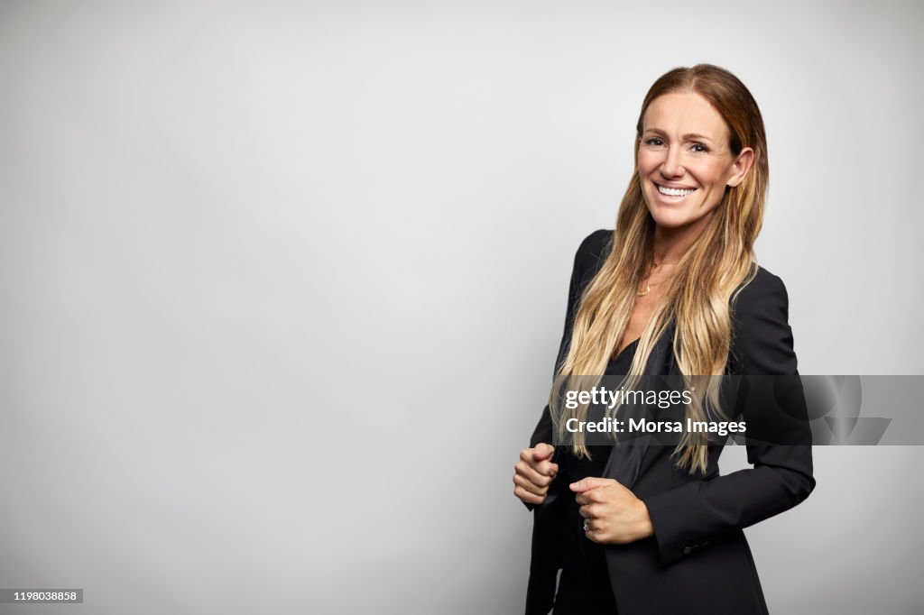 Smiling businesswoman in black business casual