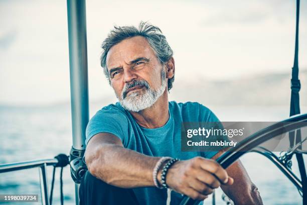 skipper sailing on sailboat - sailing club stock pictures, royalty-free photos & images