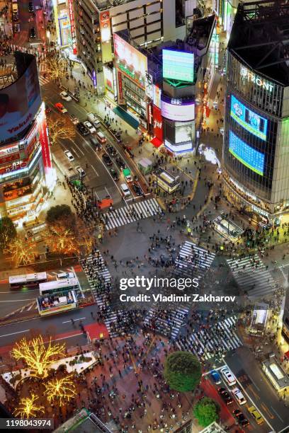 aerial view of shibuya crossing at night - shibuya crossing stock pictures, royalty-free photos & images