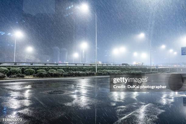 empty road in beijing cbd - wet road stock pictures, royalty-free photos & images