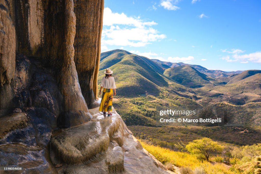 Tourist exploring the petrified waterfalls at Hierve el Agua, Oaxaca, Mexico