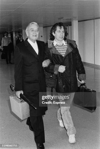 English film director, producer, screenwriter and editor David Lean and American director, producer, and screenwriter Steven Spielberg at an airport,...