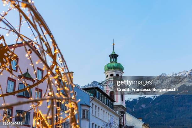 christmas lights in the old town of innsbruck - innsbruck stock pictures, royalty-free photos & images