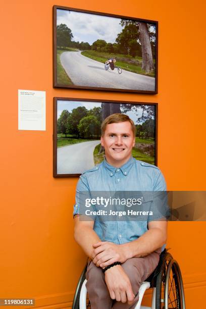 Paralympian David Weir's poses by his portrait during "Road to 2012: Changing Pace," the unveiling of new portraits of the people making London 2012...