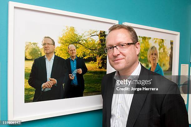 Director of London 2012 for Olympic host nation broadcaster, the BBC Roger Mosey, poses by his portrait during "Road to 2012: Changing Pace," the...