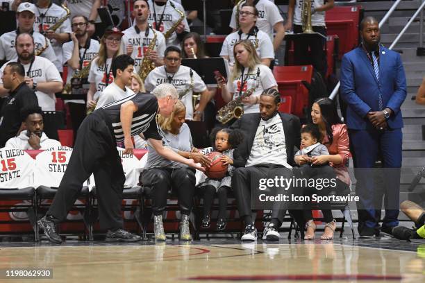 All-star and San Diego State Aztecs alumni Kawhi Leonard with his family during a college basketball game between the Utah State Aggies and the San...