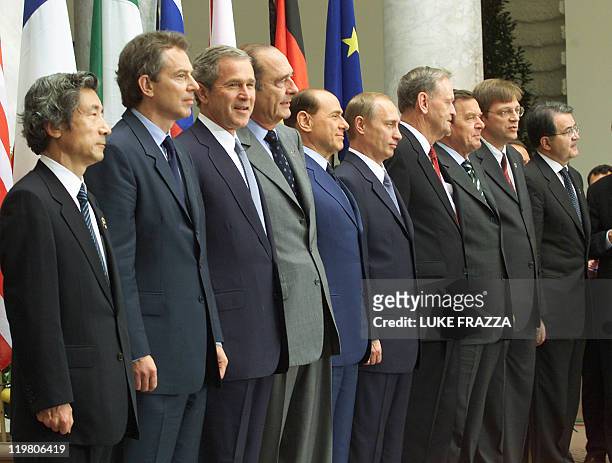 Leaders at the G-8 economic summit including Japanese Prime Minister Junichiro Koizumi, British Prime Minister Tony Blair, US President George W....