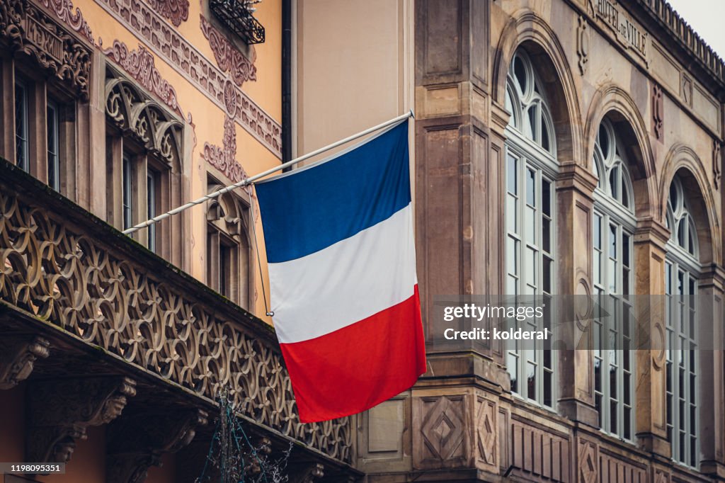 National flag of France on facade of Historic building