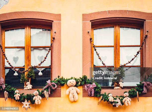 christmas decorations on old residential building - colmar stockfoto's en -beelden