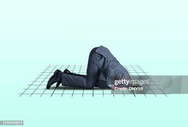 head in financial hole - head in the sand stock pictures, royalty-free photos & images