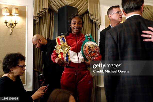 Claressa Shields holds her belts following her face off with Ivana Habazin at a press conference at Hotel Plaza Athenee prior to their January 11th,...