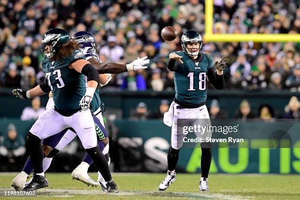 Josh McCown of the Philadelphia Eagles attempts a pass against the Seattle Seahawks in the NFC Wild Card Playoff game at Lincoln Financial Field on...