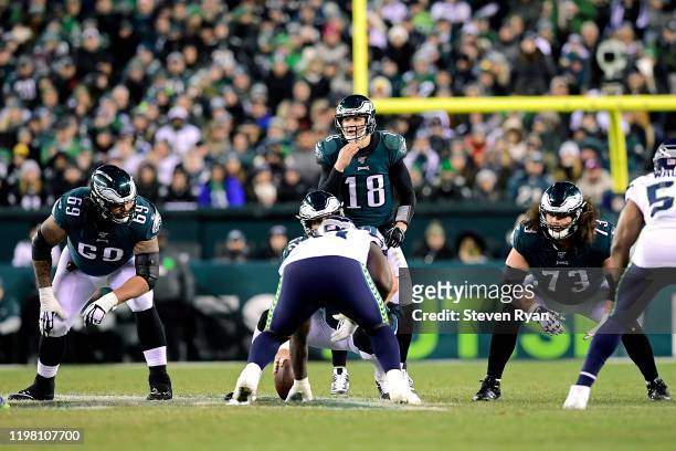 Josh McCown of the Philadelphia Eagles prepares to snap the ball against the Seattle Seahawks in the NFC Wild Card Playoff game at Lincoln Financial...