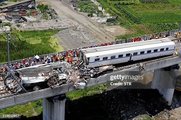 This aerial photo taken on July 24, 2011 shows rescue operations continuing on the wreckages of two high-speed trains that collided the night before...