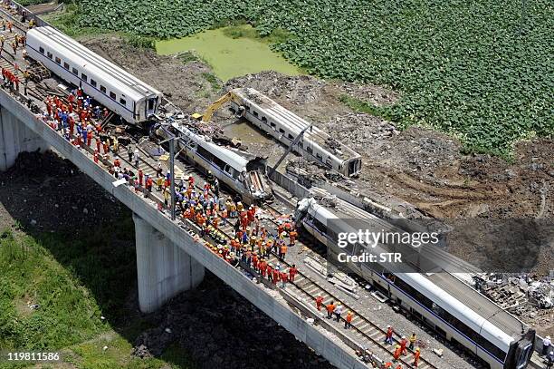 This aerial photo taken on July 24, 2011 shows rescue operations continuing on the wreckages of two high-speed trains that collided the night before...