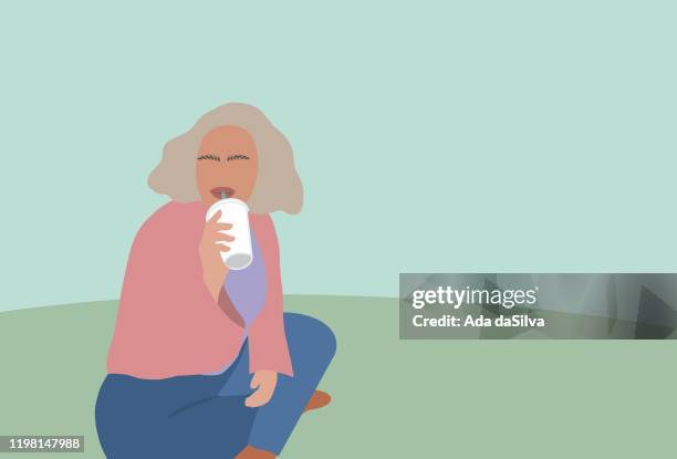 a girl sitting on green and drinking a smoothie. - only teenage girls stock illustrations